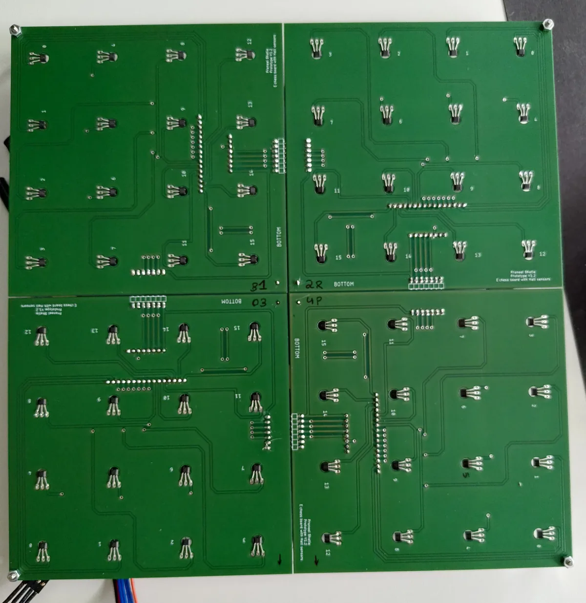 Four custom-fabricated Hall-effect sensor PCBs for the electronic chess board
